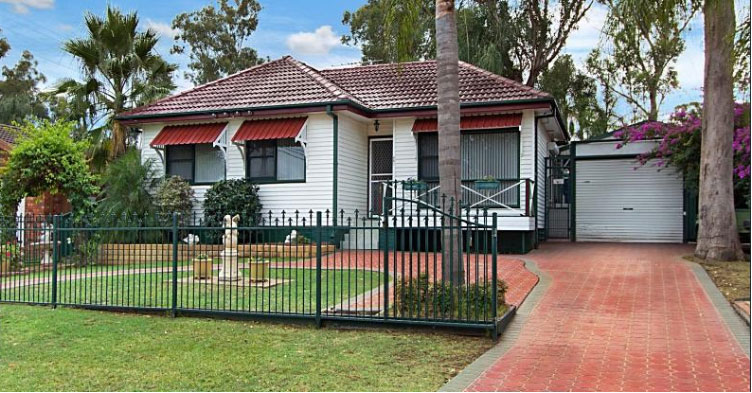 Photo of a nicely presented 3-bedroom weatherboard house with a well maintained front yard.